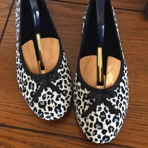 Leopard print black, blue and gray flats.